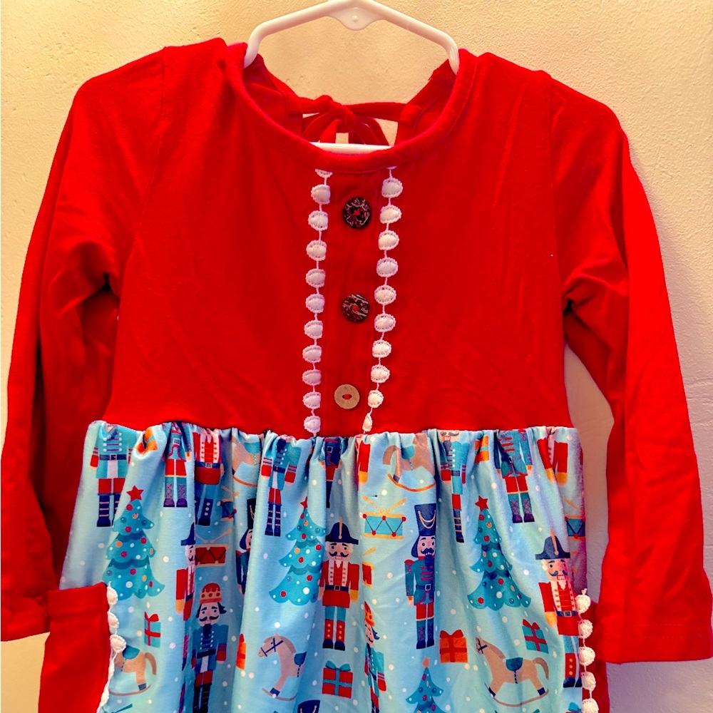 Ruffle hem toy soldier pocket detail soft twirl tie back Holiday dress 5T